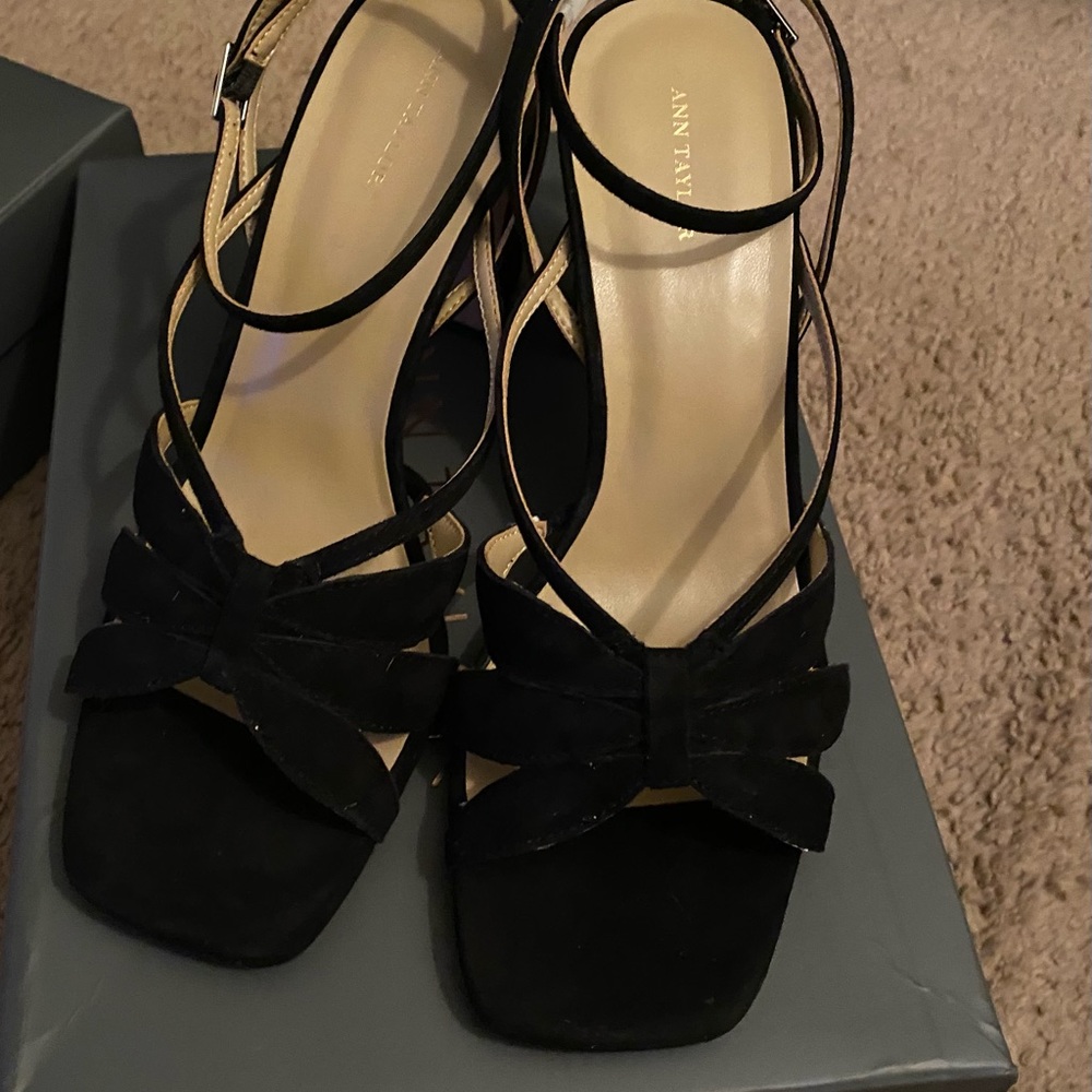 Black suede petal ankle strap sandal.